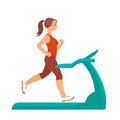 Young woman is exercising on a treadmill