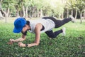 Young woman exercising workout fitness doing planking outside on Royalty Free Stock Photo