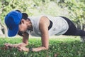 Young woman exercising workout fitness doing planking outside on Royalty Free Stock Photo