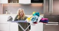 Young Woman Exhausted While Ironing Clothes Royalty Free Stock Photo