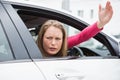 Young woman experiencing road rage Royalty Free Stock Photo