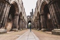 Young woman exploring Kirkstall Abbey in Leeds
