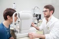 Young woman is during an eye exam with the ophthalmologist Royalty Free Stock Photo