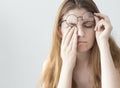 Young woman with eye fatigue Royalty Free Stock Photo