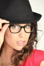 Young woman with eyeglasses and black hat