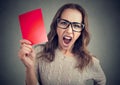 Screaming woman with red card