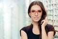 Young Woman with Eyeglasses in Optical Store