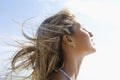 Young Woman With Eyes Closed Enjoying Sunlight