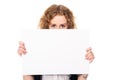 Young woman eyes over a blank promotional display isolated on a Royalty Free Stock Photo