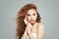 Young woman face. Beautiful girl with long wavy hair and clear skin on gray background Royalty Free Stock Photo