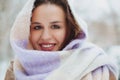 Young woman face covered with light colored knitted scarf Royalty Free Stock Photo