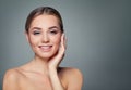 Young woman face. Healthy skin, cute smile. Perfect girl smiling. Facial treatment, skincare and cosmetology concept Royalty Free Stock Photo