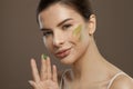 Young woman face with moisture cream. Facial treatment and skin care concept Royalty Free Stock Photo