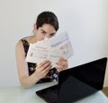 Young Woman Facing Paying her Bills Royalty Free Stock Photo