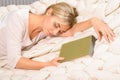 Young woman falls asleep while reading