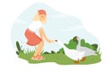 Young woman farmer feeds geese. The girl takes care of the poultry. A cute girl stands on a green lawn and holds out