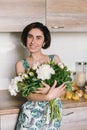 Young woman in fashon dress holding bouquet of beautiful white peonies flowers Royalty Free Stock Photo