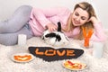 A young woman is feeding her beloved rabbit.