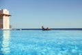 Young woman feel freedom and enjoying relaxationin infinity pool , travel and leisure, vacation retreat in Bali. Royalty Free Stock Photo