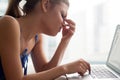 Young woman feeling tired, massaging nose bridge, suffering from Royalty Free Stock Photo