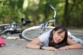 Young woman fell off bike Royalty Free Stock Photo