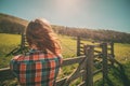 Young woman by a fence on a ranch Royalty Free Stock Photo