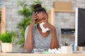 young woman with fever at work