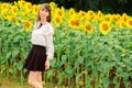 Young woman in a field of sunflowers. Royalty Free Stock Photo