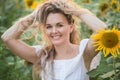 Young woman in a field of sunflowers. sunset light in the field of sunflowers