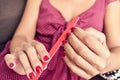 Young woman filing her fingernails Royalty Free Stock Photo