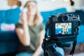 Young woman filming video blog on camera, blogger influencer profession concept Royalty Free Stock Photo