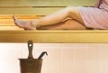 Young woman in Finnish city sauna. Girl enjoying the hot air and spending relaxed time. Royalty Free Stock Photo