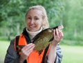 The young woman the fisherman with caught the bream