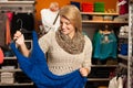 Young woman fitting a dress looking herself in a m Royalty Free Stock Photo