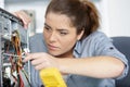 Young woman fix pc component in service center Royalty Free Stock Photo