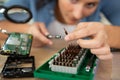 young woman fix pc component in service center Royalty Free Stock Photo