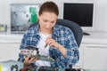 Young woman fixing computer motherboard Royalty Free Stock Photo