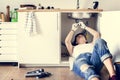 Young woman fixing kitchen sink Royalty Free Stock Photo