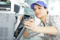 young woman fixing printer Royalty Free Stock Photo