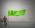 Young woman with flag . Mixed media Royalty Free Stock Photo