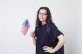 Young woman with the flag of the United States of America.