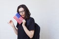 Young woman with the flag of the United States of America.