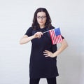 Young woman with the flag of the United States of America.