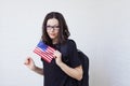 Young woman with the flag of the United States of America.