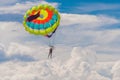 Young woman flies on a parachute among the clouds Royalty Free Stock Photo