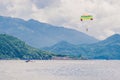 Young woman flies on a parachute among the clouds Royalty Free Stock Photo