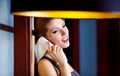 A young woman flirting on the phone