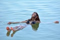 Young Woman floating on the Dead Sea, Israel Royalty Free Stock Photo
