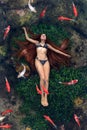 Young woman floating in water Royalty Free Stock Photo