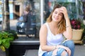 Young woman on the floor street looking in camera using Royalty Free Stock Photo